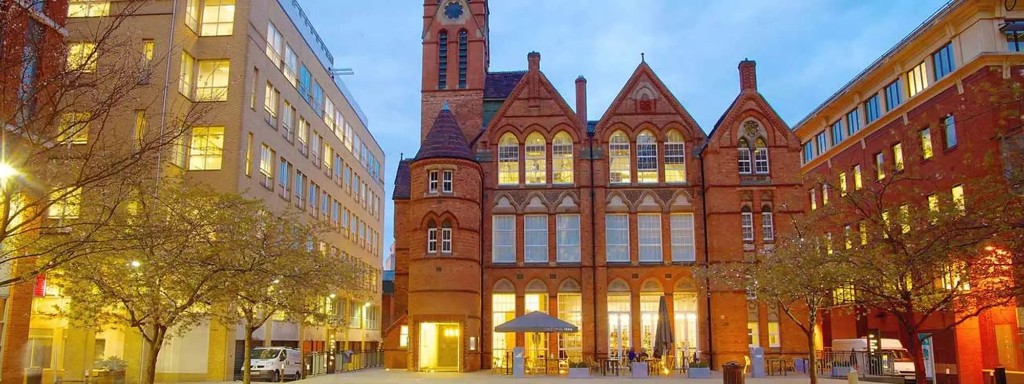 Ikon Gallery in Brindleyplace at dusk with outdoor café seating