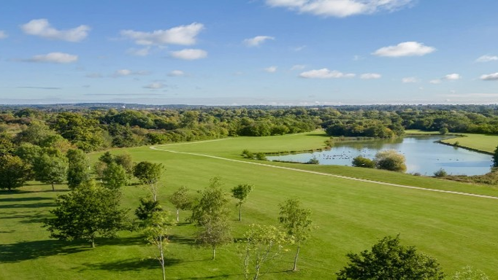 West Midlands Golf Club fairway and lake on a sunny day