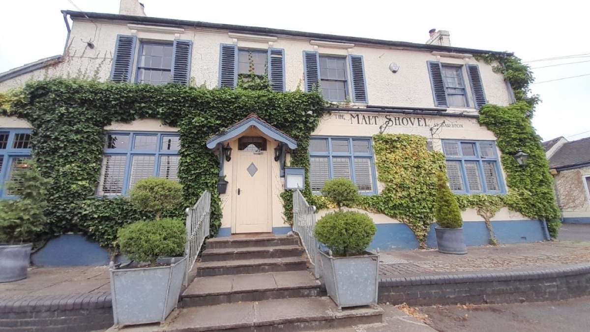 The Malt Shovel at Barston pub exterior with ivy-covered walls